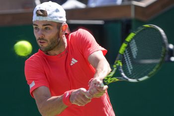 Jacob Fearnley hits a shot during his loss to Joao Fonseca at the BNP Paribas Open in Indian Wells, Calif., March 6, 2025.