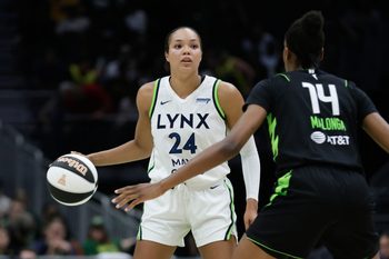 Jun 11, 2025; Seattle, Washington, USA; Minnesota Lynx forward Napheesa Collier (24) dribbles with Seattle Storm center Dominique Malonga (14) defending during the second half at Climate Pledge Arena. Mandatory Credit: John Froschauer-Imagn Images