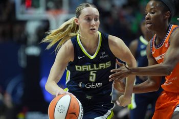 Jun 20, 2025; Uncasville, Connecticut, USA; Dallas Wings guard Paige Bueckers (5) drives the ball against Connecticut Sun guard Lindsay Allen (15) in the first half at Mohegan Sun Arena. Mandatory Credit: David Butler II-Imagn Images