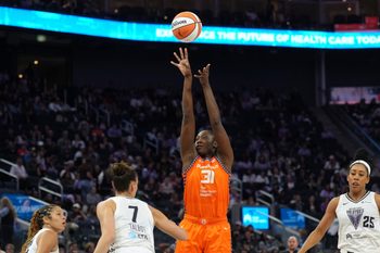 Jun 22, 2025; San Francisco, California, USA; Connecticut Sun center Tina Charles (31) shoots against Golden State Valkyries forward Stephanie Talbot (7) during the third quarter at Chase Center. Mandatory Credit: Darren Yamashita-Imagn Images