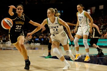 Jun 24, 2025; Washington, District of Columbia, USA; Washington Mystics guard Sonia Citron (22) and Minnesota Lynx guard Karlie Samuelson (44) chase a loose ball in the first half at Entertainment & Sports Arena. Mandatory Credit: Geoff Burke-Imagn Images