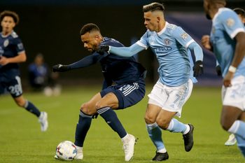 May 7, 2022; New York, NY, New York, NY, USA; Sporting Kansas City forward Khiry Shelton (11) and New York City FC midfielder Alfredo Morales (7) fight for the ball during the second half at Citi Field. Mandatory Credit: Brad Penner-Imagn Images