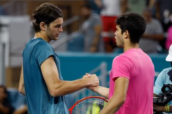 Mar 30, 2023; Miami, Florida, US; Carlos Alcaraz (ESP) (R) shakes hands with Taylor Fritz (USA) (L) after their men's singles quarterfinal on day eleven of the Miami Open at Hard Rock Stadium. Mandatory Credit: Geoff Burke-Imagn Images