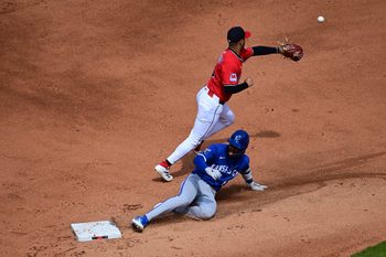 Apr 13, 2025; Cleveland, Ohio, USA; Kansas City Royals third baseman Maikel Garcia (11) slides into second base after hitting an RBI double in the fifth inning against the Cleveland Guardians at Progressive Field. Mandatory Credit: David Dermer-Imagn Images