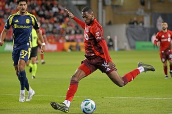 May 24, 2025; Toronto, Ontario, CAN;  Toronto FC forward Tyrese Spicer (16) shoots the ball against Nashville SC in the second half at BMO Field. Mandatory Credit: Dan Hamilton-Imagn Images