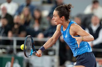 Jun 5, 2025; Paris, FR;  Lois Boisson of France returns a shot during her match against Coco Gauff of the United States on day 12 at Roland Garros Stadium. Mandatory Credit: Susan Mullane-Imagn Images