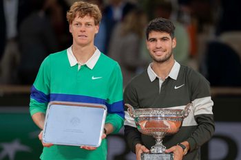 Jun 8, 2025; Paris, FR; Jannik Sinner of Italy and Carlos Alcaraz of Spain pose together at the trophy presentation after the men’s singles final on day 15 at Roland Garros Stadium. Mandatory Credit: Susan Mullane-Imagn Images