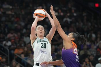 Jun 27, 2025; Phoenix, Arizona, USA; New York Liberty forward Breanna Stewart (30) shoots over Phoenix Mercury forward Alyssa Thomas (25) during the second half at Footprint Center. Mandatory Credit: Joe Camporeale-Imagn Images