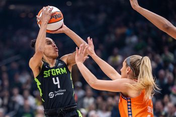Jun 27, 2025; Seattle, Washington, USA;  Seattle Storm guard Skylar Diggins (4) shoots the ball Connecticut Sun guard Jacy Sheldon (4) at Climate Pledge Arena. Mandatory Credit: Stephen Brashear-Imagn Images