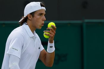 Jul 3, 2025; Wimbledon, United Kingdom; Arthur Cazaux (FRA) blows on his hand prior to serving against Alex de Minaur (AUS)(not pictured) on day four of The Championships Wimbledon 2025 at All England Lawn Tennis and Croquet Club. Mandatory Credit: Geoff Burke-Imagn Images