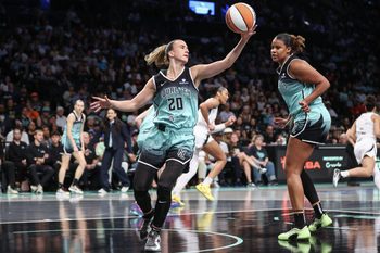 Jul 8, 2025; Brooklyn, New York, USA;  New York Liberty guard Sabrina Ionescu (20) grabs a rebound in the first quarter against the Las Vegas Aces at Barclays Center. Mandatory Credit: Wendell Cruz-Imagn Images