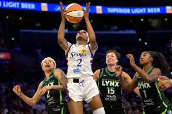 Jul 10, 2025; Los Angeles, California, USA;  Los Angeles Sparks forward Rickea Jackson (2) rebounds in front of Minnesota Lynx guard Natisha Hiedeman (2), forward Jessica Shepard (15) and forward Diamond Miller (1) in the second half at Crypto.com Arena. Mandatory Credit: Jayne Kamin-Oncea-Imagn Images