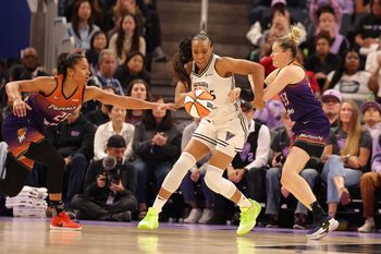 Jul 14, 2025; San Francisco, California, USA; Golden State Valkyries forward Kayla Thornton (5) controls the ball between Phoenix Mercury forward Alyssa Thomas (25) and Phoenix Mercury guard Sami Whitcomb (33) during the third quarter at Chase Center. Mandatory Credit: Kelley L Cox-Imagn Images