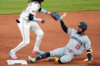 Jul 15, 2025; Cumberland, Georgia, USA; American League outfielder Byron Buxton (25) of the Minnesota Twins slides into second base after hitting a double during the ninth inning during the 2025 MLB All Star Game at Truist Park. Mandatory Credit: Dale Zanine-Imagn Images