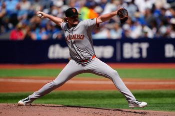 Jul 19, 2025; Toronto, Ontario, CAN; San Francisco Giants starting pitcher Logan Webb (62) pitches to the Toronto Blue Jays during the first inning at Rogers Centre. Mandatory Credit: John E. Sokolowski-Imagn Images