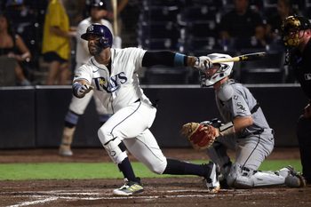 Jul 21, 2025; St. Petersburg, Florida, USA;  Tampa Bay Rays designated hitter Yandy Diaz (2) hits a home run during the seventh inning against the Chicago White Sox at George M. Steinbrenner Field. Mandatory Credit: Kim Klement Neitzel-Imagn Images