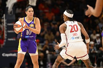 Jul 22, 2025; Washington, District of Columbia, USA;  Los Angeles Sparks guard Kelsey Plum (10) looks to pass the ball in front of Washington Mystics guard Brittney Sykes (20) during the first quarter at CareFirst Arena. Mandatory Credit: Rafael Suanes-Imagn Images