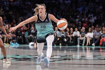 Jul 22, 2025; Brooklyn, New York, USA;  New York Liberty guard Sabrina Ionescu (20) brings the ball up court in the first quarter against the Indiana Fever at Barclays Center. Mandatory Credit: Wendell Cruz-Imagn Images