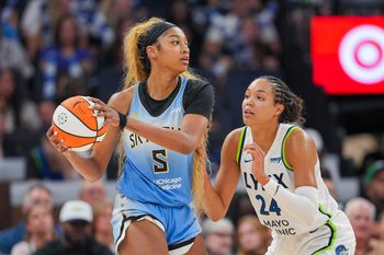Jul 22, 2025; Minneapolis, Minnesota, USA; Minnesota Lynx forward Napheesa Collier (24) defends Chicago Sky forward Angel Reese (5) in the fourth quarter at Target Center. Mandatory Credit: Brad Rempel-Imagn Images