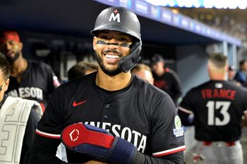 Jul 22, 2025; Los Angeles, California, USA; Minnesota Twins shortstop Carlos Correa (4) in the dugout after scoring a run against the Los Angeles Dodgers at Dodger Stadium. Mandatory Credit: Jayne Kamin-Oncea-Imagn Images