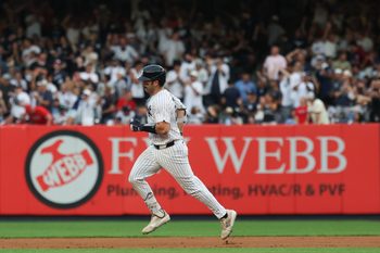 Jul 25, 2025; Bronx, New York, USA; New York Yankees catcher Austin Wells (28) runs the bases after hitting a solo home run during the second inning against the Philadelphia Phillies at Yankee Stadium. Mandatory Credit: Vincent Carchietta-Imagn Images