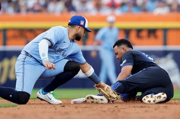 Jul 25, 2025; Detroit, Michigan, USA;  Detroit Tigers outfielder Wenceel Perez (46) steals second ahead of Toronto Blue Jays shortstop Bo Bichette (11) in the second inning at Comerica Park. Mandatory Credit: Rick Osentoski-Imagn Images