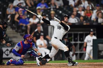 Jul 26, 2025; Chicago, Illinois, USA; Chicago White Sox right fielder Mike Tauchman (18) hits a solo home run during the ninth inning against the Chicago Cubs at Rate Field. Mandatory Credit: Patrick Gorski-Imagn Images