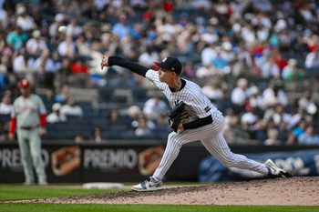 Jul 27, 2025; Bronx, New York, USA; New York Yankees pitcher Luke Weaver (30) pitches against the Philadelphia Phillies during the seventh inning at Yankee Stadium. Mandatory Credit: John Jones-Imagn Images