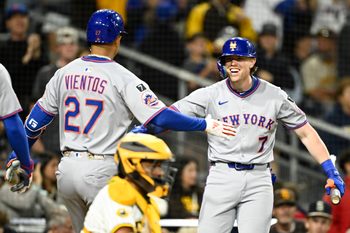 Jul 28, 2025; San Diego, California, USA; New York Mets third baseman Mark Vientos (27) is congratulated by Brett Baty (7) after hitting a grand slam during the fifth inning against the San Diego Padres at Petco Park. Mandatory Credit: Denis Poroy-Imagn Images