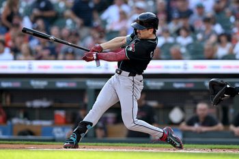 Jul 29, 2025; Detroit, Michigan, USA;  Arizona Diamondbacks right fielder Corbin Carroll (7) hits a leadoff triple against the Detroit Tigers in the first inning at Comerica Park. Mandatory Credit: Lon Horwedel-Imagn Images