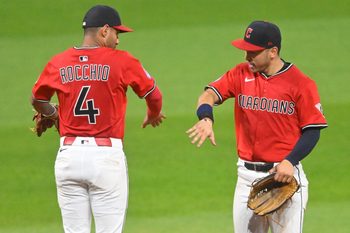 Jul 29, 2025; Cleveland, Ohio, USA; Cleveland Guardians second baseman Brayan Rocchio (4) and left fielder Steven Kwan (38) celebrate a win over the Colorado Rockies at Progressive Field. Mandatory Credit: David Richard-Imagn Images
