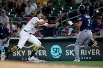 Jul 29, 2025; West Sacramento, California, USA; Athletics first baseman Nick Kurtz (16) catches the ball for a force out against the Seattle Mariners during the ninth inning at Sutter Health Park. Mandatory Credit: Dennis Lee-Imagn Images