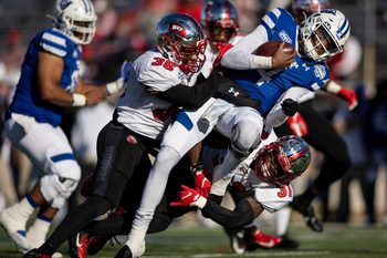 Dec 26, 2020; Mobile, AL, USA;  Western Kentucky Hilltoppers linebacker Kyle Bailey (36) and defensive back Antwon Kincade (31) hit Georgia State Panthers quarterback Cornelious Brown IV (4) during the first quarter at Ladd-Peebles Stadium. Mandatory Credit: Vasha Hunt-Imagn Images