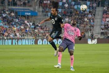 Jul 20, 2022; Minneapolis, MN, USA; Minnesota United midfielder Aziel Jackson (25) makes a play over Everton defender Niels Nkounkou (18) in the second half at Allianz Field. Mandatory Credit: Matt Blewett-Imagn Images