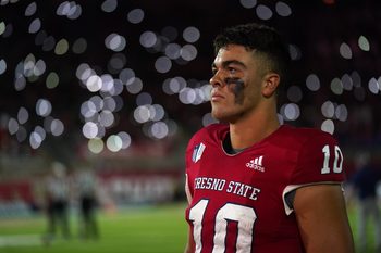 Oct 15, 2022; Fresno, California, USA; Fresno State Bulldogs quarterback Logan Fife (10) stands on the sideline against the San Jose State Spartans before the start of the fourth quarter at Valley Children's Stadium. Mandatory Credit: Cary Edmondson-Imagn Images