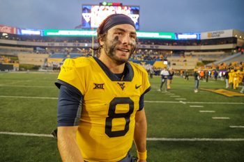 Sep 23, 2023; Morgantown, West Virginia, USA; West Virginia Mountaineers quarterback Nicco Marchiol (8) celebrates after defeating the Texas Tech Red Raiders at Mountaineer Field at Milan Puskar Stadium. Mandatory Credit: Ben Queen-Imagn Images