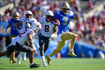 Oct 7, 2023; Pasadena, California, USA; UCLA Bruins quarterback Dante Moore (3) runs the ball ahead of Washington State Cougars defensive back Tanner Moku (32) during the second half at Rose Bowl. Mandatory Credit: Gary A. Vasquez-Imagn Images