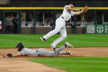 Jun 27, 2024; Chicago, Illinois, USA;  Colorado Rockies outfielder Brenton Doyle (9) steals second base under Chicago White Sox shortstop Paul DeJong (29) during the first inning at Guaranteed Rate Field. Mandatory Credit: Matt Marton-Imagn Images