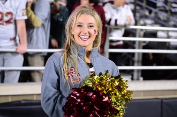 Oct 25, 2024; Chestnut Hill, Massachusetts, USA; A Boston College Eagles cheerleader poses for a photo during the first half against the Louisville Cardinals at Alumni Stadium. Mandatory Credit: Eric Canha-Imagn Images