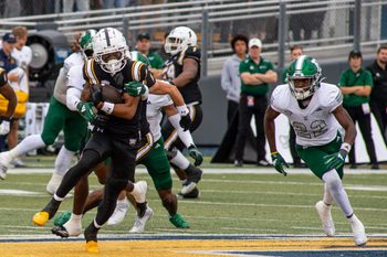 Kent State wide receiver Chrishon McCray is tackled by Eastern Michigan after receiving a pass during the game against Eastern Michigan, Saturday, Sept. 28, 2024.