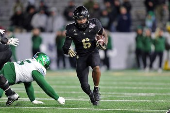 Dec 6, 2024; West Point, NY, USA; Army Black Knights running back Kanye Udoh (6) runs the ball against the Tulane Green Wave during the second half at Michie Stadium. Mandatory Credit: Danny Wild-Imagn Images