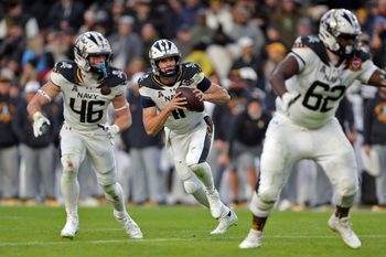 Dec 14, 2024; Landover, Maryland, USA; Navy Midshipmen quarterback Blake Horvath (11) looks to pass against the Army Black Knights during the first half of the the 125th Army-Navy game at Northwest Stadium. Mandatory Credit: Danny Wild-Imagn Images