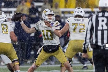 Dec 27, 2024; Birmingham, AL, USA; Georgia Tech Yellow Jackets quarterback Haynes King (10) looks to throw against the Vanderbilt Commodores during the second half of the 2024 Birmingham Bowl at Protective Stadium. Mandatory Credit: Vasha Hunt-Imagn Images