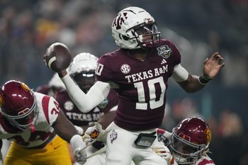 Dec 27, 2024; Las Vegas, NV, USA; Texas A&M Aggies quarterback Marcel Reed (10) throws the ball against Southern California Trojans cornerback John Humphrey (19) in the first half at Allegiant Stadium. Mandatory Credit: Kirby Lee-Imagn Images