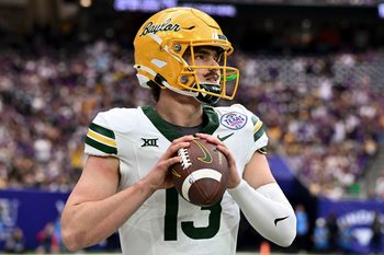 Dec 31, 2024; Houston, TX, USA; Baylor Bears quarterback Sawyer Robertson (13) warms up on the sideline during the first half against the LSU Tigers at NRG Stadium. Mandatory Credit: Maria Lysaker-Imagn Images