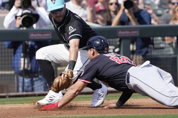 Arizona Diamondbacks third baseman Garrett Hampson tags out Cleveland Guardians Micah Pries during a spring training game at Salt River Fields on Feb. 24, 2025.
