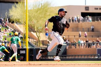 Arizona Diamondbacks 	Garrett Hampson scores on a Randal Grichuk single off Athletics starting pitcher Joey Estes in the second inning during a spring training game at Salt River Fields in Scottsdale on March 20, 2025.