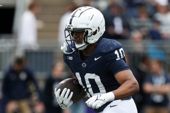 Apr 26, 2025; University Park, PA, USA; Penn State Nittany Lions running back Nicholas Singleton (10) runs a play during a warm up prior to the Blue White spring game at Beaver Stadium. Mandatory Credit: Matthew O'Haren-Imagn Images