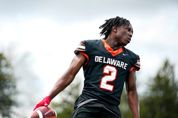 Delaware Hayes’s Favour Akih (2) participates in a drill during the college football showcase at the Delaware Hayes High School on Wednesday, May 7, 2025 in Delaware, Ohio.