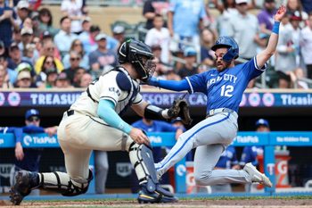 May 25, 2025; Minneapolis, Minnesota, USA; Kansas City Royals left fielder Nick Loftin (12) scores the go ahead run on a double hit third baseman Maikel Garcia (11) during the tenth inning against the Minnesota Twins at Target Field. Mandatory Credit: Matt Krohn-Imagn Images